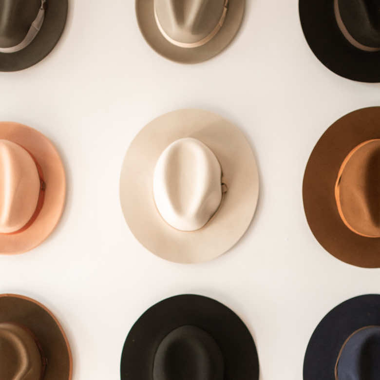 Nine panama hats arranged in a square grid